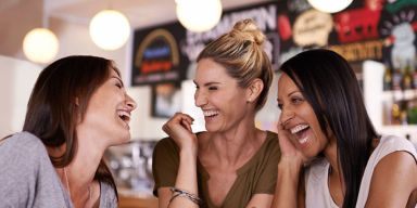 landscape-1433812400-friends-laughing-together-in-a-cafe