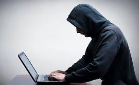 man on computer stalking