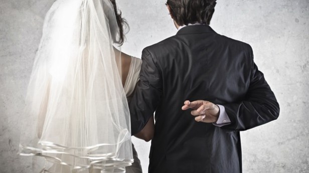 bride and groom-fingers crossed