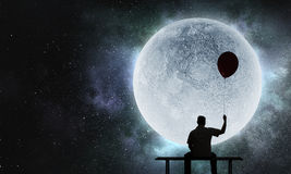 feeling-lonely-world-mixed-media-fat-man-sitting-bench-against-full-moon-background-96551139